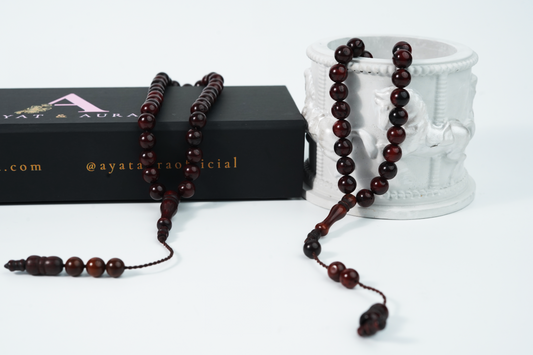 Close-up of deep brown wooden beads with smooth satin finish