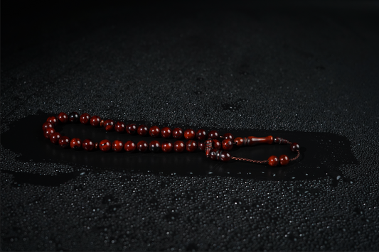 Close-up of deep brown wooden beads with smooth satin finish