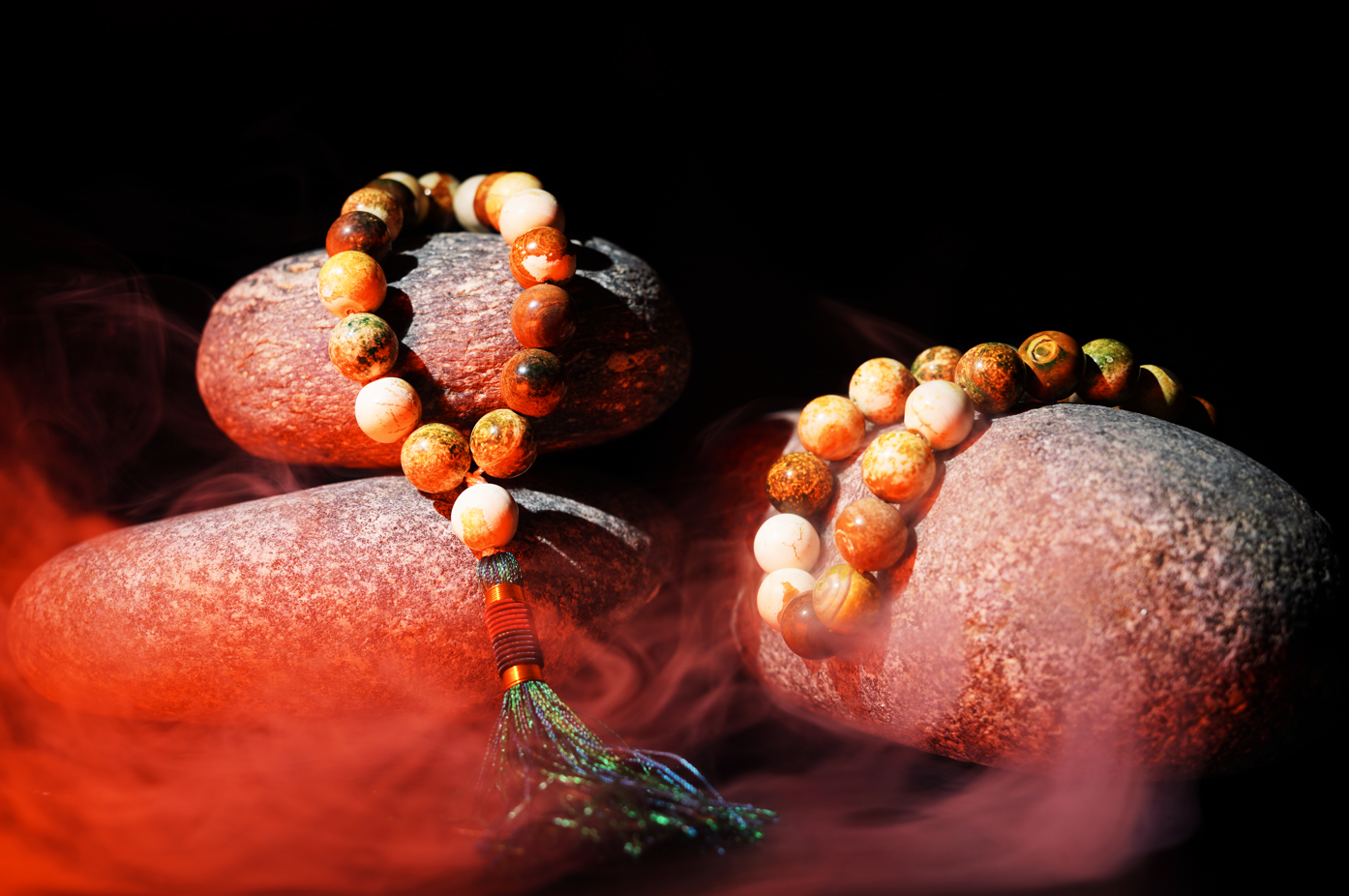 Agate prayer beads styled on stones with mist