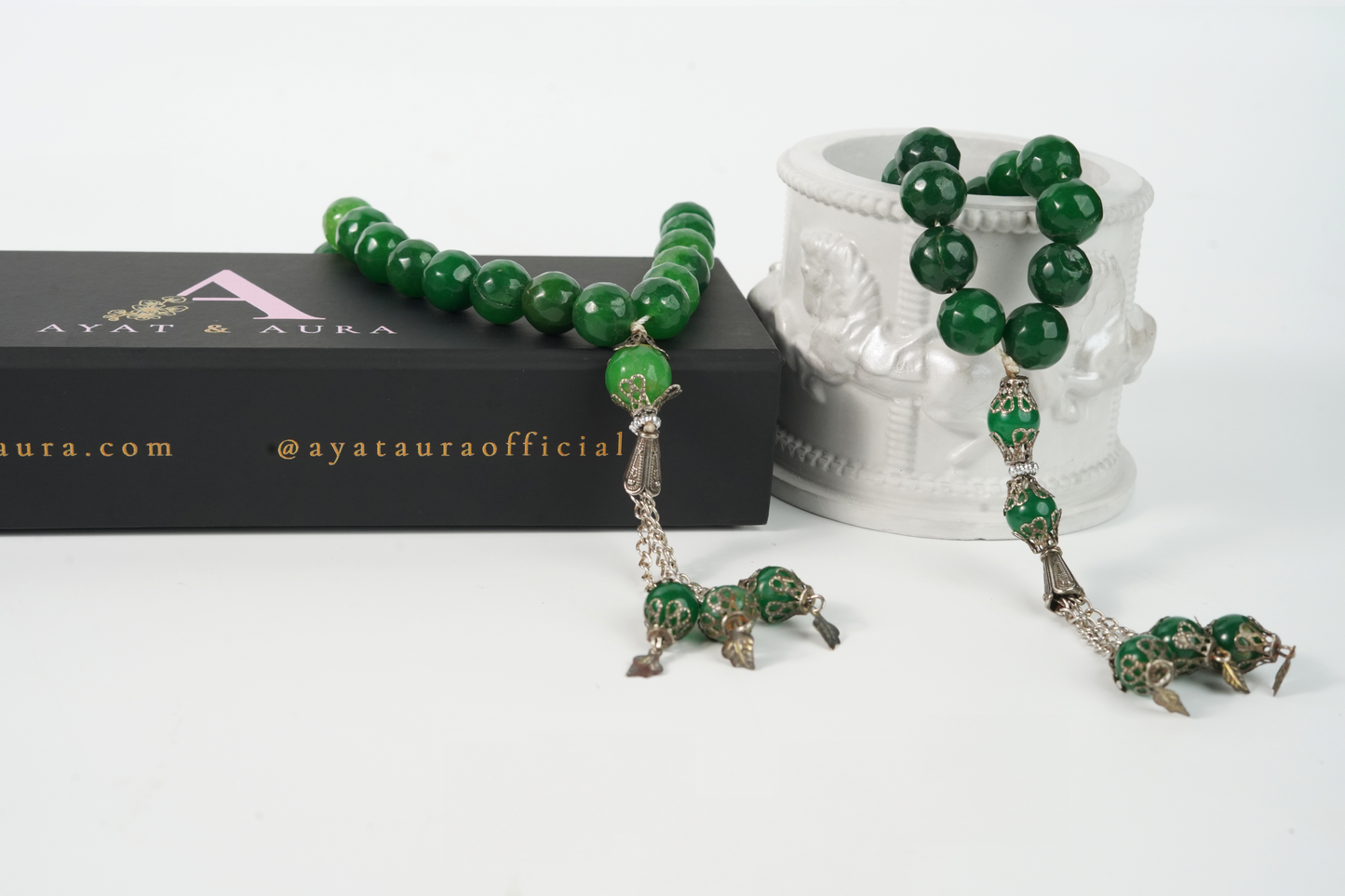 Agate green beaded Tasbih set with silver accents on a white background, featuring the Ayata Aura brand.