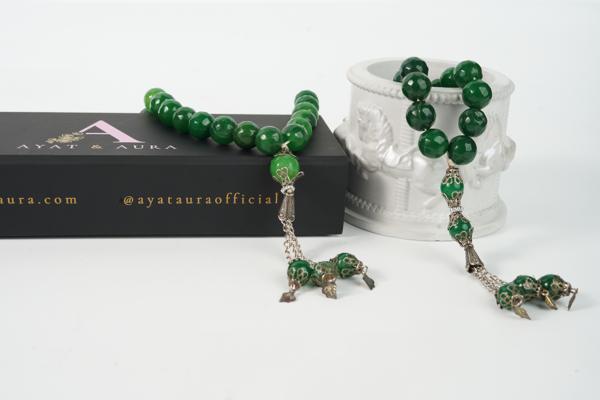 Agate green beaded Tasbih set with silver accents on a white background, featuring the Ayata Aura brand.
