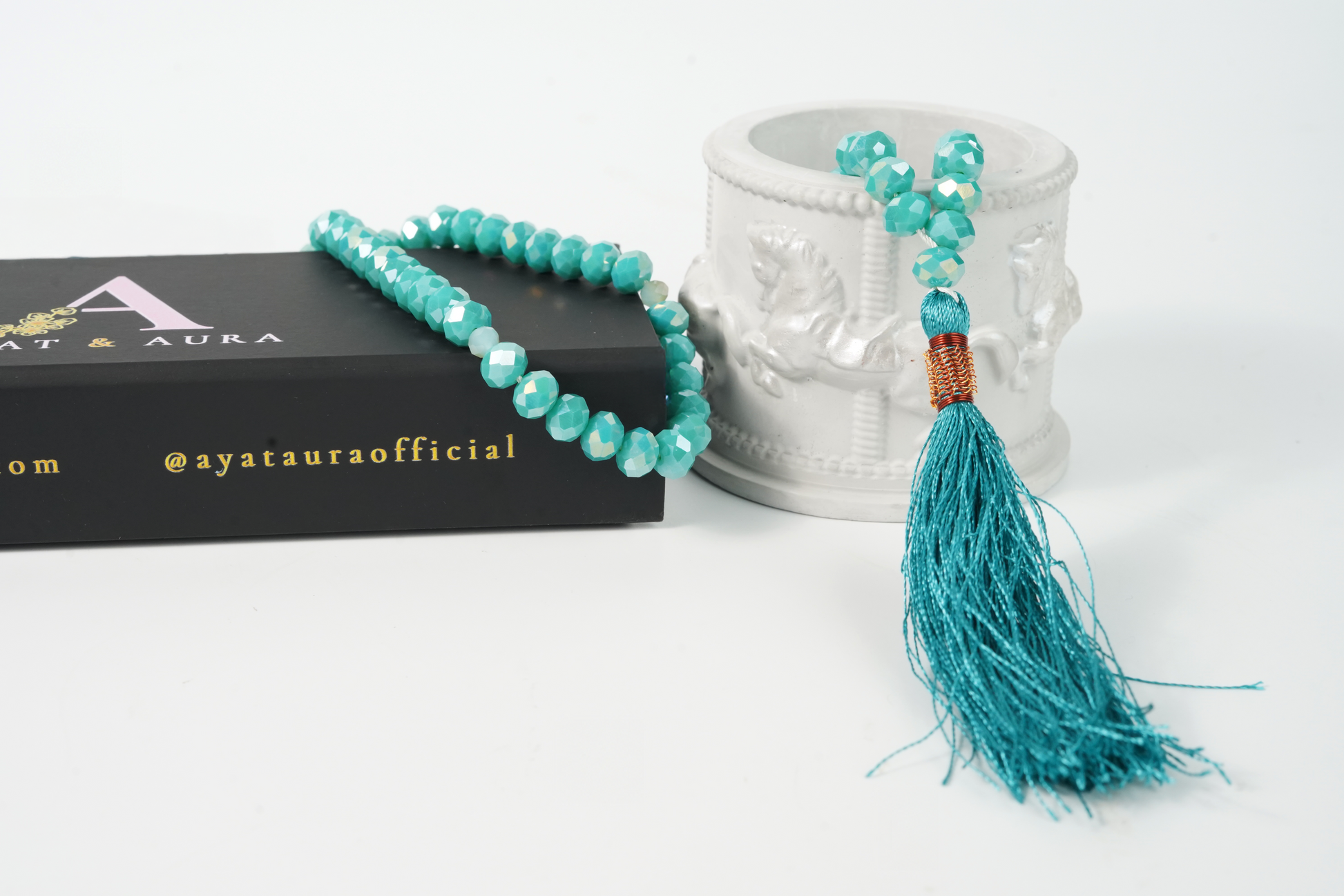 Alternate studio shot highlighting facets and tassel.