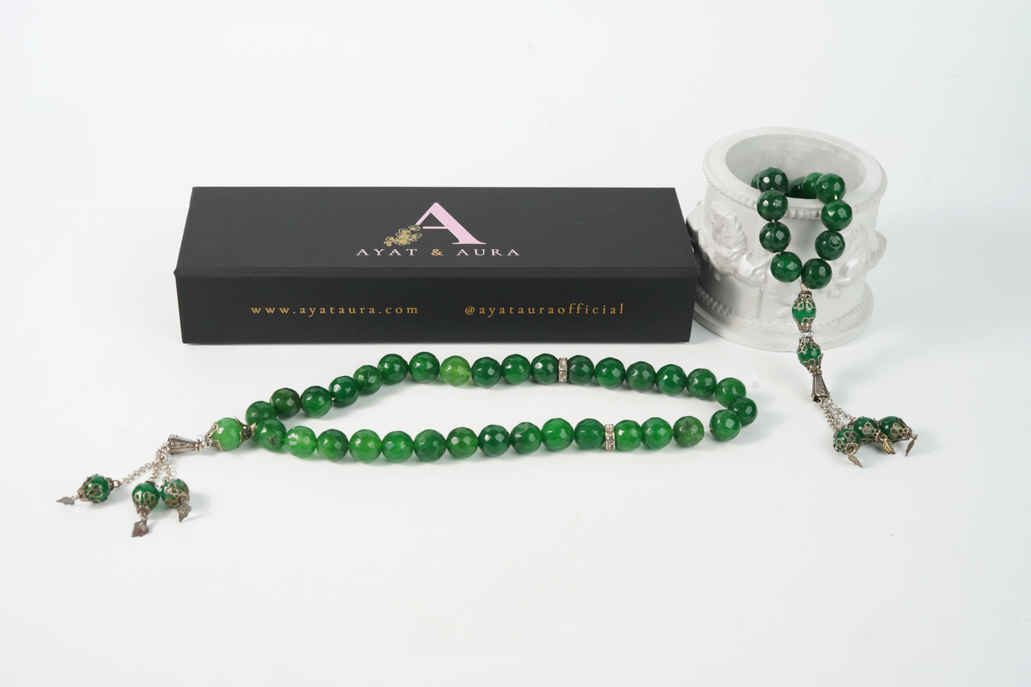 Agate green Tasbih on white background next to Ayat & Aura branded gift box