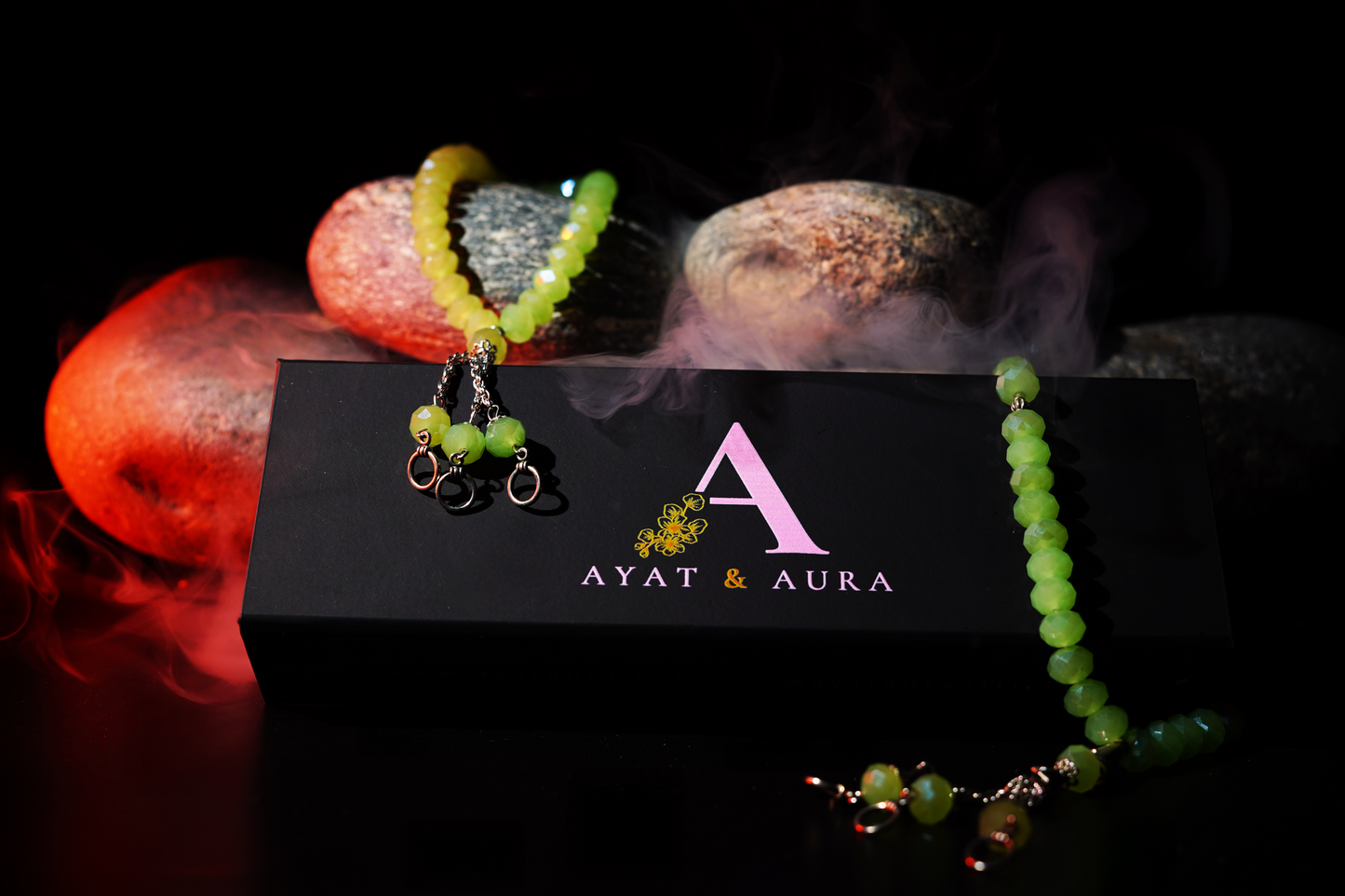 Resin prayer beads styled on stones with mist