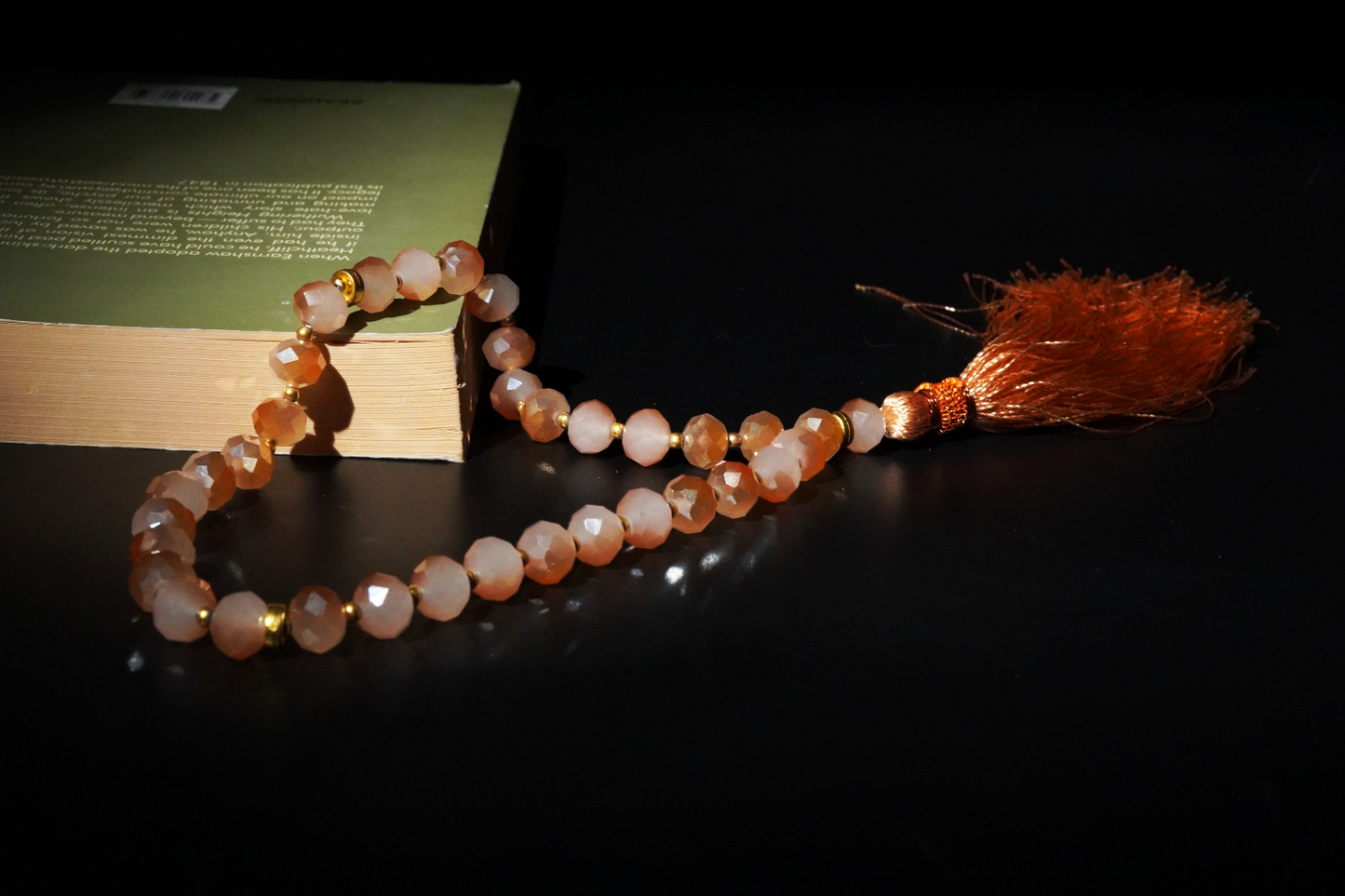 Close-up of faceted beads and gold tassel