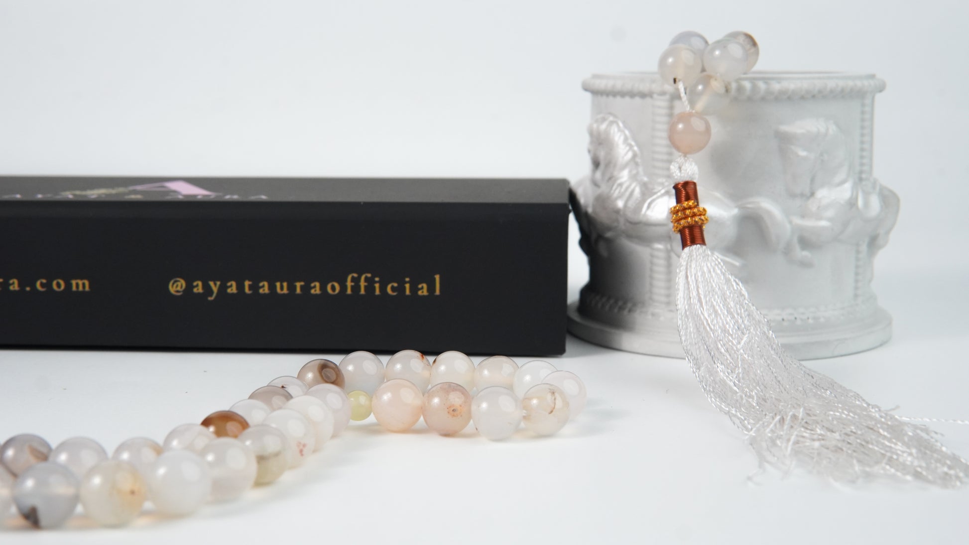 Close-up of agate beads and white tassel