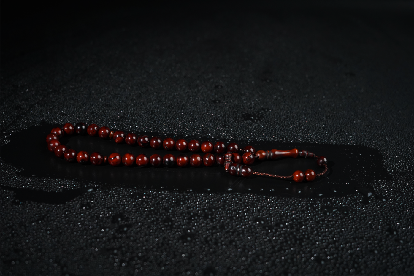 Close-up of deep brown wooden beads with smooth satin finish