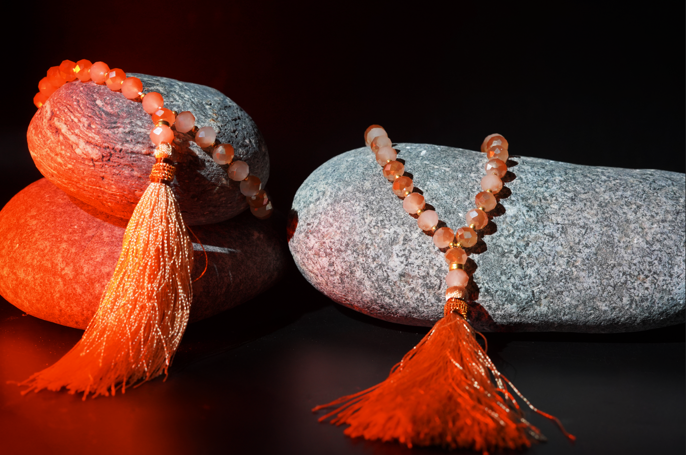 Resin prayer beads styled on stones with mist